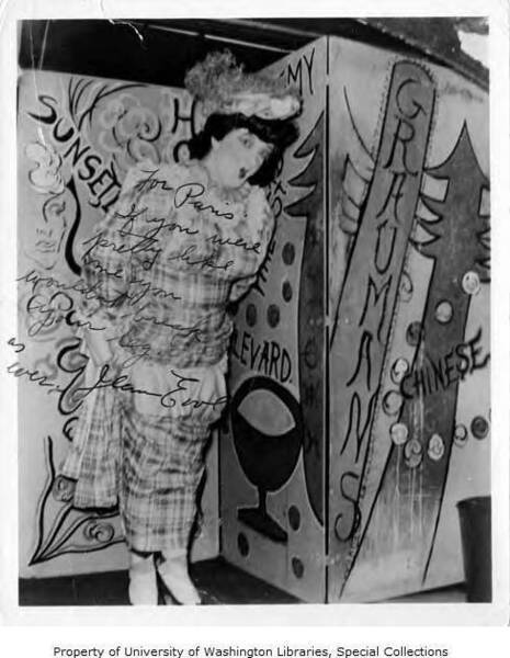 Download the full-sized image of Jean Evol in drag in front of painted background