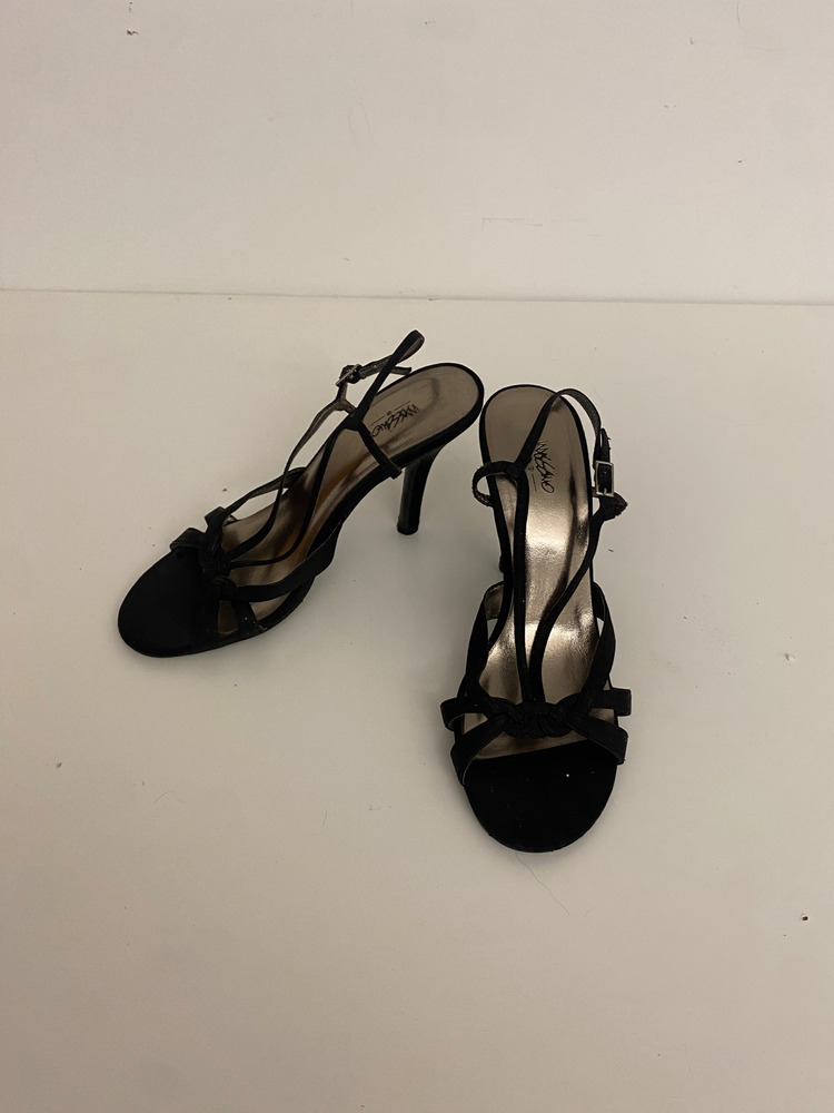 Download the full-sized PDF of Photo of Black Strap Heels