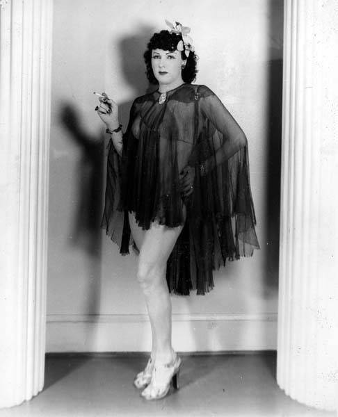 Download the full-sized image of Jackie Starr in a sheer top and bikini