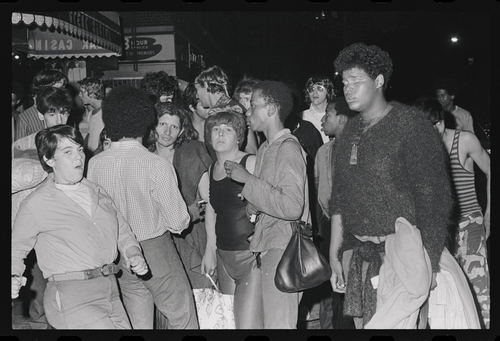 Download the full-sized image of A Photograph of Sylvia Rivera Surrounded by a Large Crowd at Weinstein Hall Demonstration