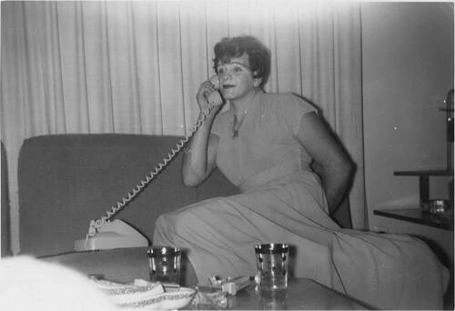 Download the full-sized image of Unknown femme on the phone at a house party