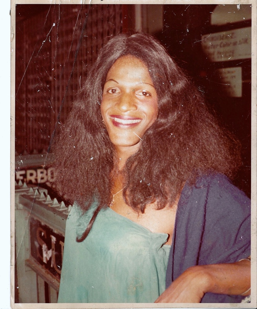 Download the full-sized image of A Photograph of Marsha P. Johnson Wearing a Teal Strapless Top