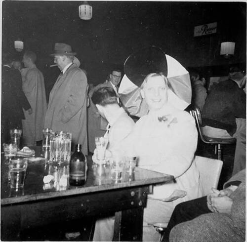 Download the full-sized image of Countess Estelle at a party with men in the background