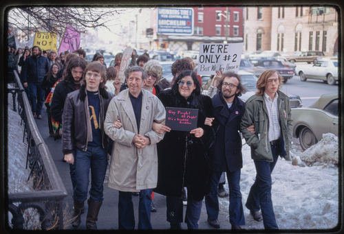 Download the full-sized image of Sylvia Rivera and Lee Brewster Marching Down Sidewalk with Demonstrators