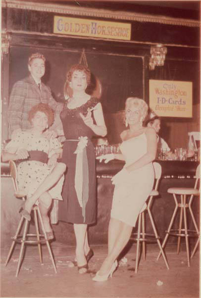 Download the full-sized image of Three unknown femmes and a masc at the Golden Horseshoe