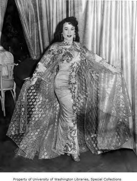 Download the full-sized image of Paris DeLaire performing in dress with long cape