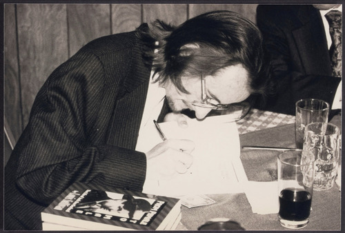 Download the full-sized image of Lou Sullivan signing book, 1990