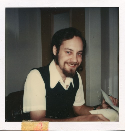 Download the full-sized image of Photograph of Rupert Raj with a Book