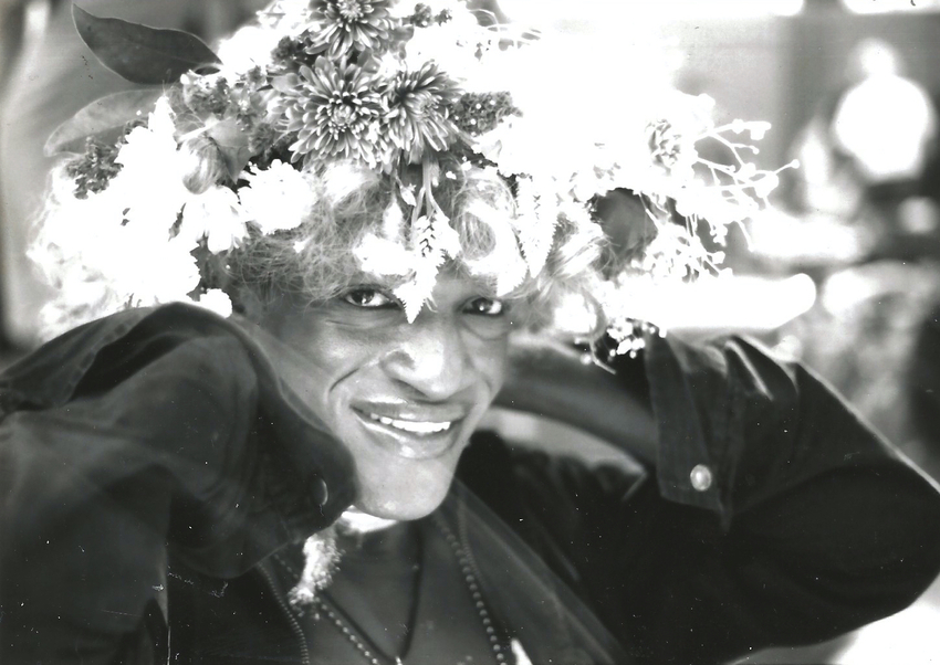 Download the full-sized image of A Photograph of Marsha P. Johnson Posing for the Camera Wearing a Flower Headpiece