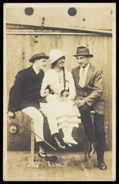 Download the full-sized image of Sailors, one in drag, performing "The Rivals". Photographic postcard, 191-.