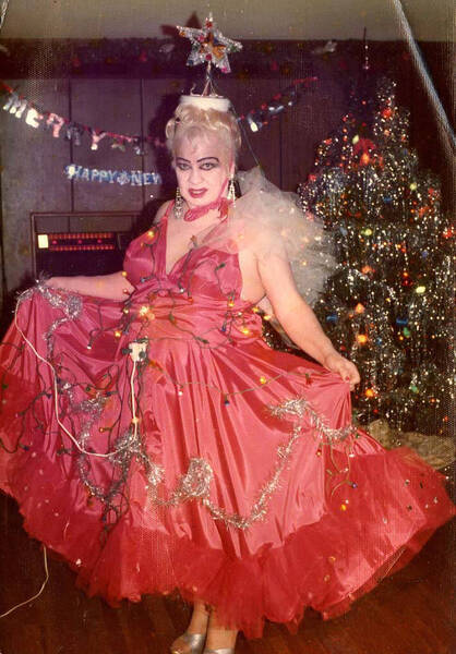 Download the full-sized image of Hotcha Hinton at a Christmas party in a dress covered in lights