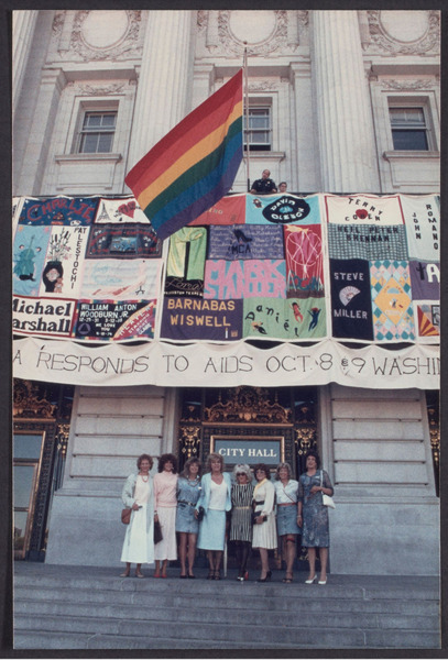 Download the full-sized image of Educational Transvestite Channel members with AIDS Quilt, 1988