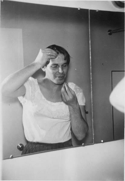 Download the full-sized image of Unknown femme getting ready in front of a mirror