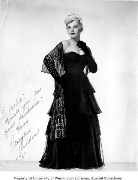 Download the full-sized image of Promotional photograph of performer Vaughn Auldon in a black dress