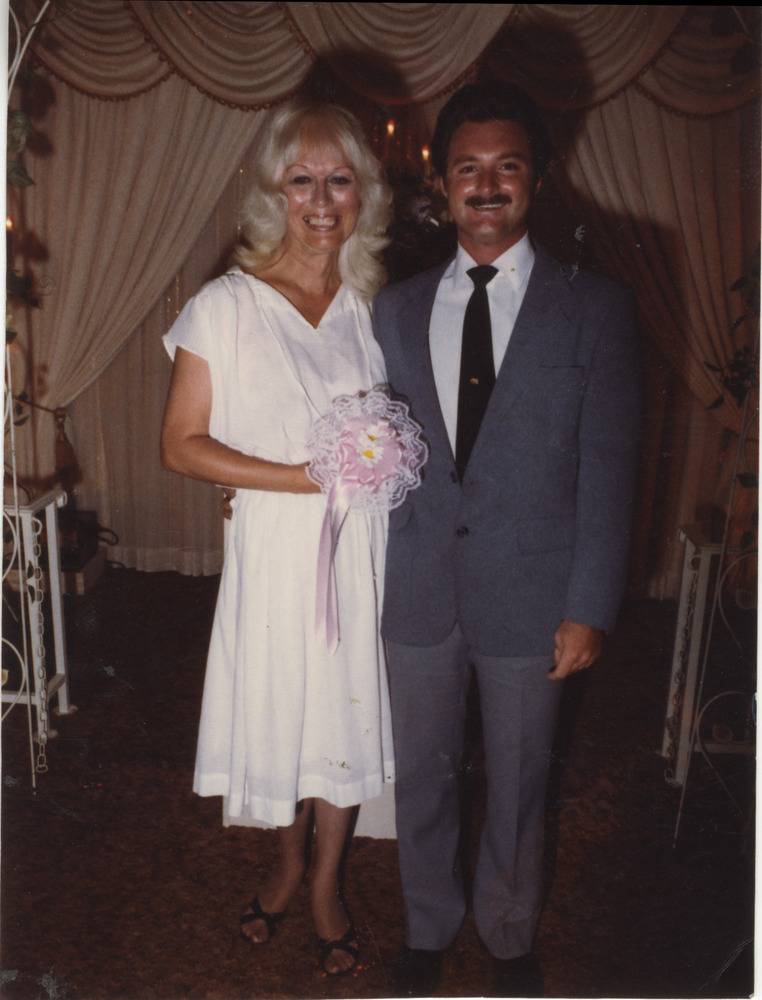 Download the full-sized image of Photo of Vicki and Bobby at Wedding Altar