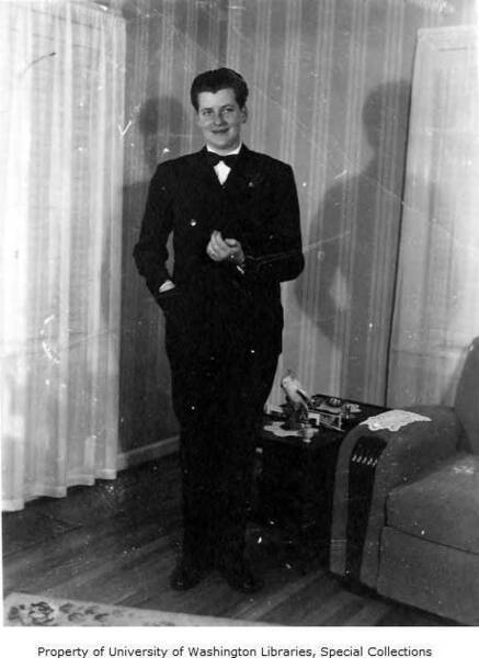 Download the full-sized image of Nick Arthur standing in a suit