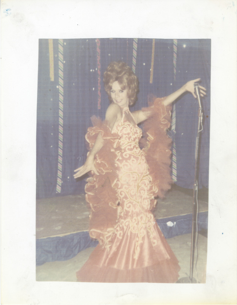 Download the full-sized image of Photo of Vicki Marlane in Orange Dress