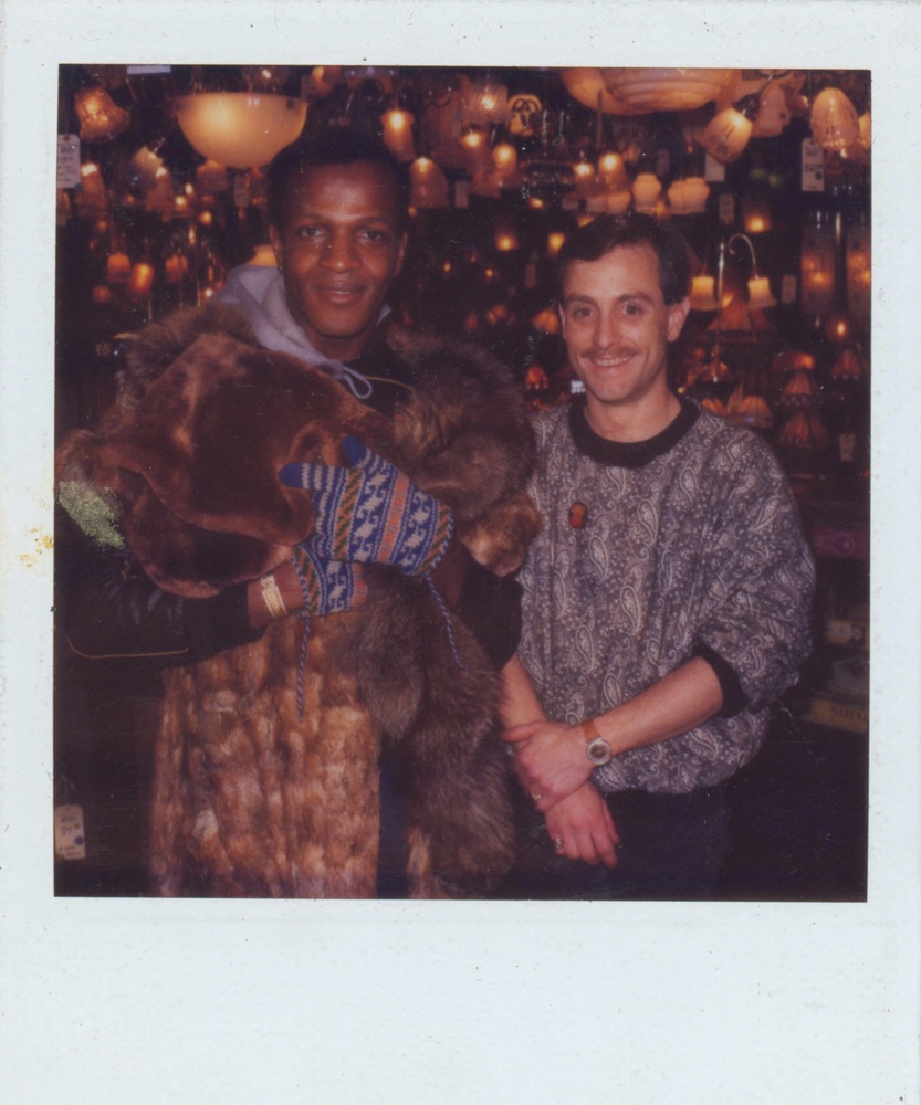 Download the full-sized image of A Photograph of Marsha P. Johnson Wearing a Fur Coat and Winter Gloves, Posing with Another Person at Uplift Lighting