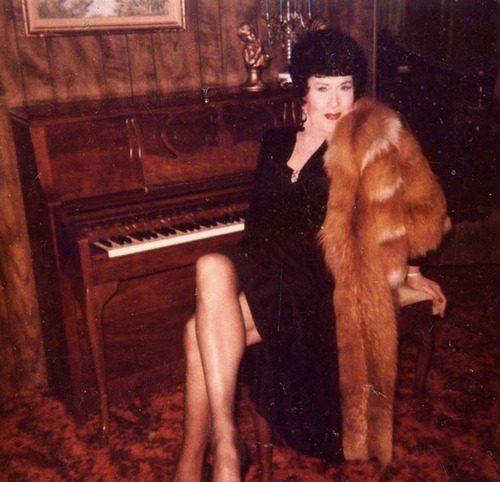 Download the full-sized image of Jackie Starr sitting by piano