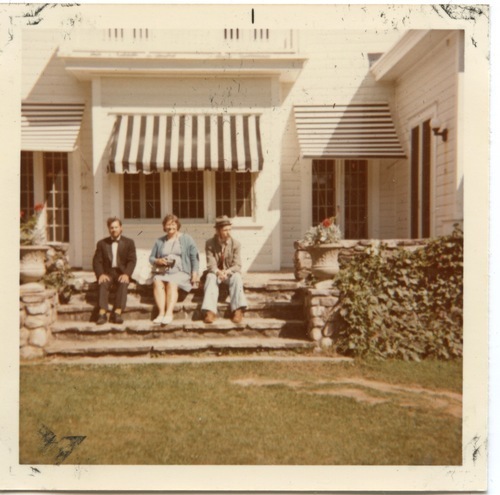 Download the full-sized image of Photograph of Rupert Raj Sitting on the Stairs with Two Others