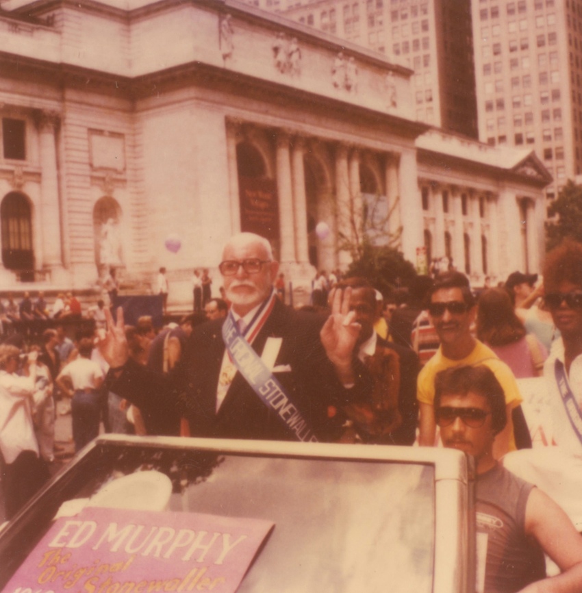 Download the full-sized image of A Photograph of Marsha P. Johnson Behind Ed Murphy in a Car at the 1985 Christopher Street Liberation Day Parade