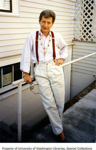 Download the full-sized image of Pat Freeman standing by the side of a house