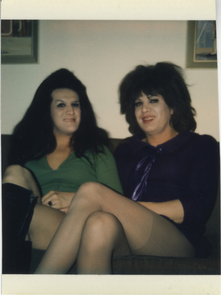 Download the full-sized image of Photo of Two People Sitting on Couch