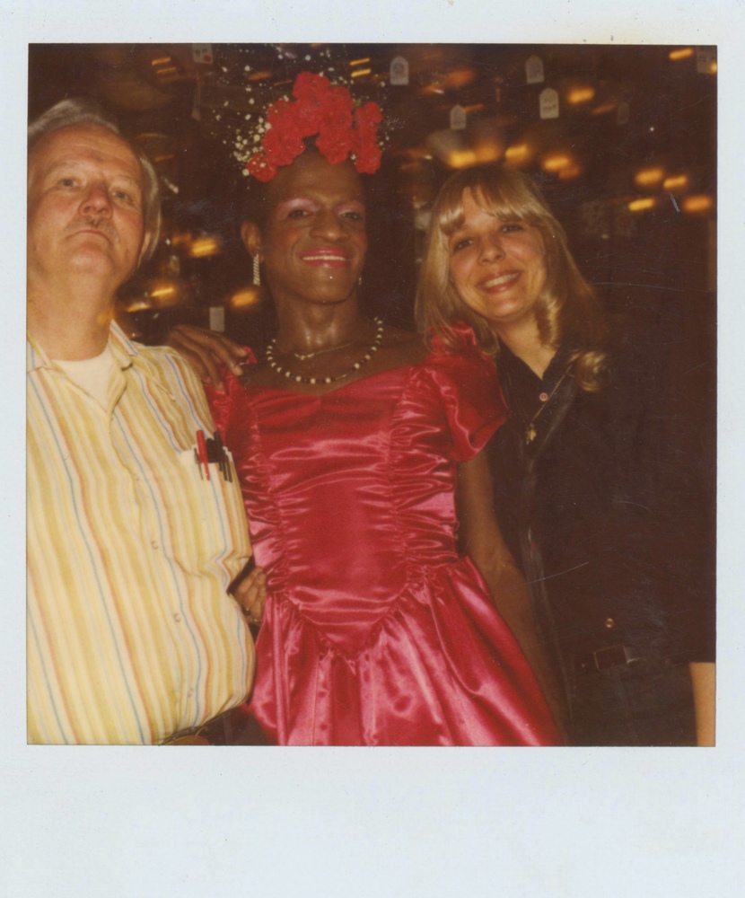 Download the full-sized image of A Photograph of Marsha P. Johnson in a Pink Dress Posing with Randy Wicker and Suzanne Phillips