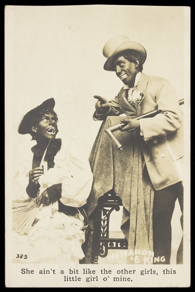 Download the full-sized image of McMahon and King, two actors made up as blackface minstrels, with King in drag. Photographic postcard, 191-.