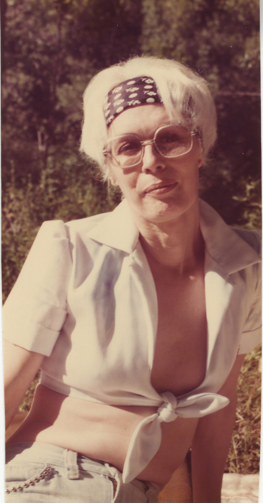 Download the full-sized image of Photo of Vicki Marlane Posed Outside in White Top