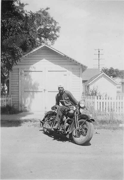 Download the full-sized image of Francis Hill Posing With Motorcycle