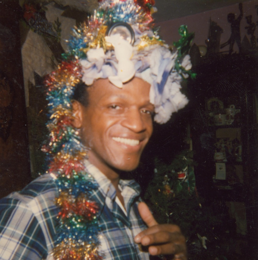 Download the full-sized image of A Photograph of Marsha P. Johnson Wearing a Headpiece Made of Tinsel and Flowers