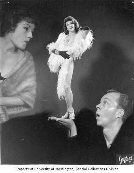 Download the full-sized image of Robin Raye and his wife Jasmine, gazing at Robin Raye's drag persona